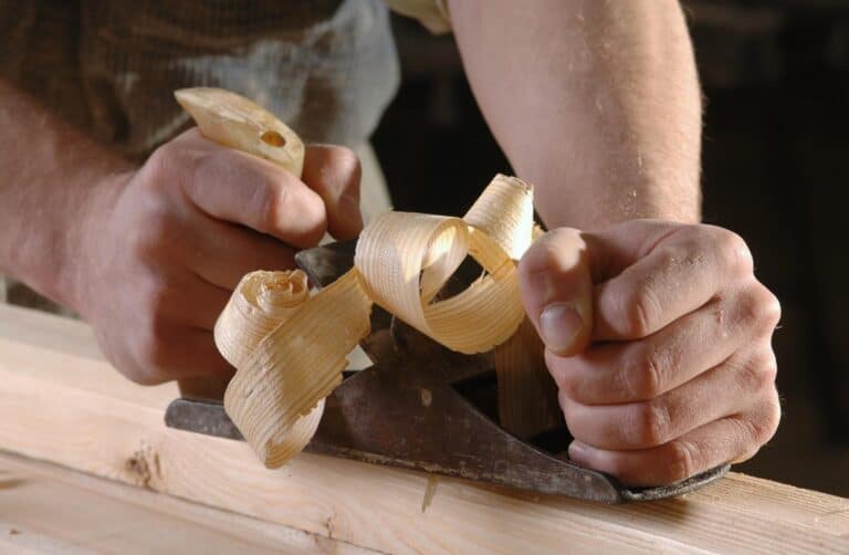 Carpenter Planing Plank